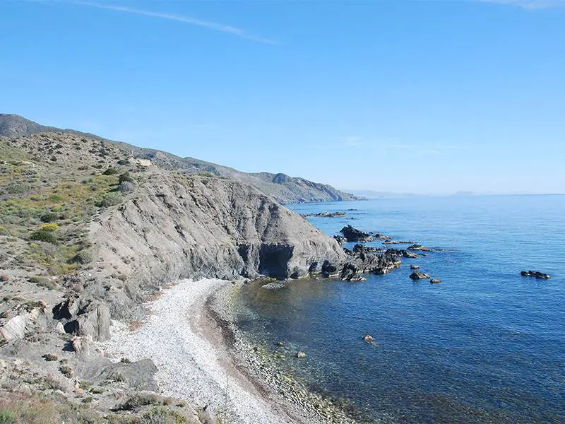 Rugged coast near Villaricos. Esperanza II in background